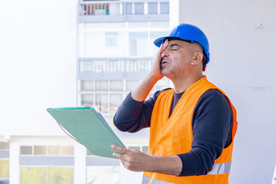 Portrait of man using digital tablet