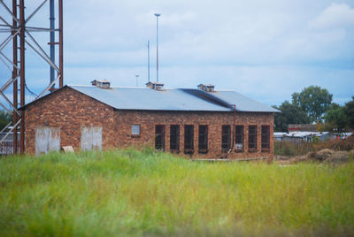 House on field against sky