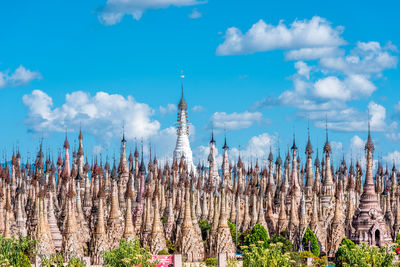 Plants growing on landscape against sky