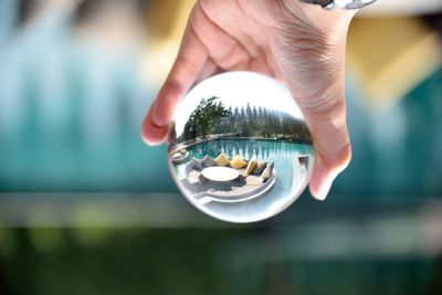 Close-up of hand holding glass