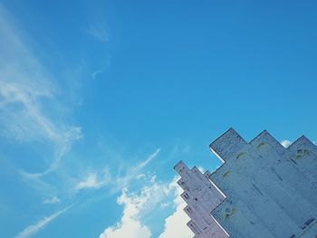 Low angle view of building against blue sky