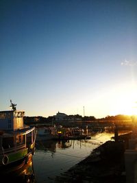 Boats moored at harbor