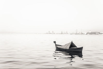 Boat in sea against clear sky