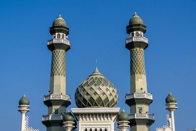 Low angle view of building against blue sky