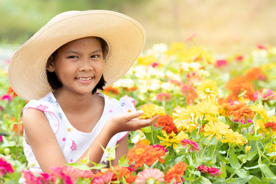Portrait of smiling girl with flowers