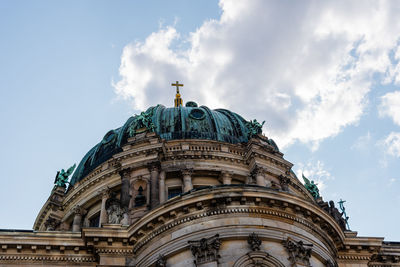 Low angle view of the dome of berlin cathedral, berliner dom, against blue sky with clouds