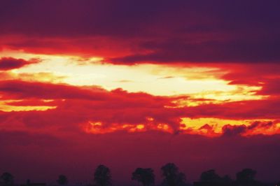 Low angle view of dramatic sky during sunset