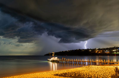 Lightning storm over port phillip bay in victoria with a menacing cloud scene
