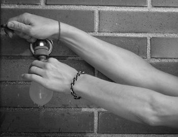 Close-up of woman hand on wall