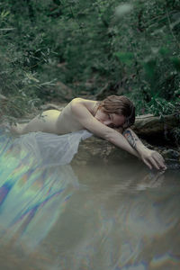 Woman lying in water