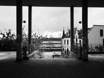 Empty road with buildings in background