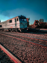 Train on railroad track against sky