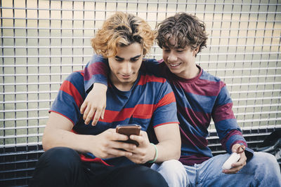 Friends sitting on mobile phone