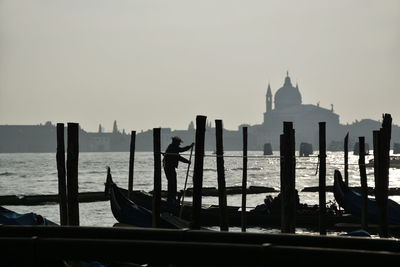 Silhouetted gondolas in venice