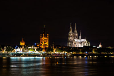 Illuminated buildings at waterfront