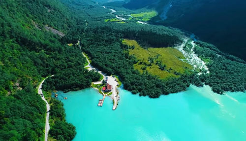 High angle view of man by sea against mountain