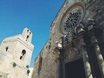 Low angle view of church against clear blue sky