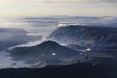 Scenic view of snowcapped mountains against sky during sunset