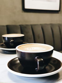 Close-up of coffee cup on table