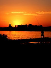 Silhouette of people at sunset