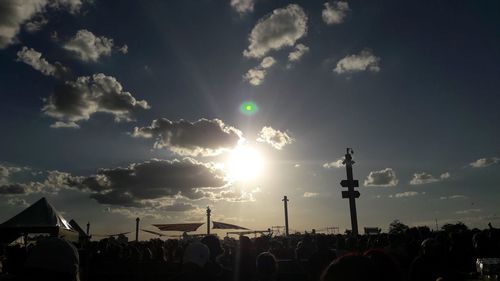 People on street against sky