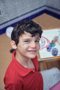 Portrait of boy smiling at home