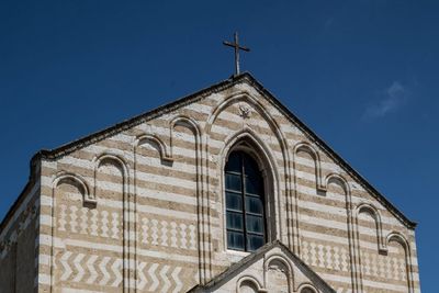 Low angle view of building against blue sky