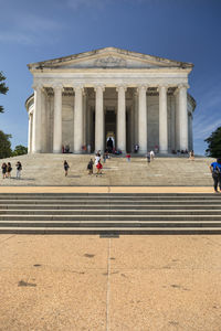 People in front of historical building