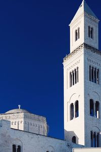 Low angle view of building against clear blue sky