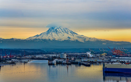 A view of the port of tacoma with overcast sky at twilight.