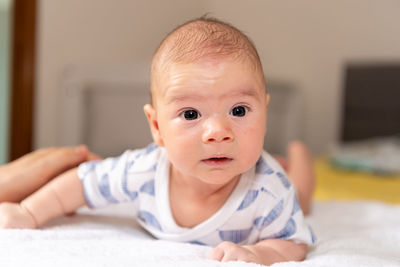 Portrait of cute baby boy at home