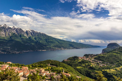 Scenic view of sea and mountains against sky