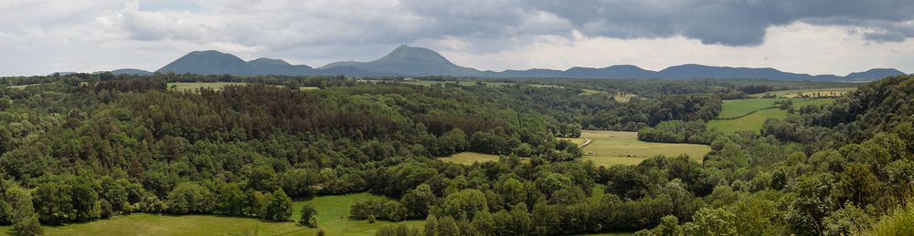 View of the chain of auvergne volcanoes under a thunderstorm