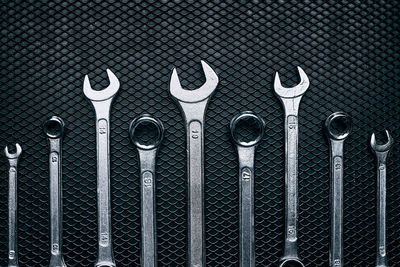 Set of chrome wrenches on steel surface. mechanic tools for maintenance. hardware tools to fix. tech