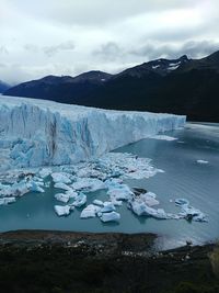 Idyllic shot of perito moreno glacier against cloudy sky