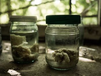 Close-up of glass of jar on table