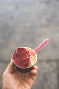 Close-up of hand holding ice cream