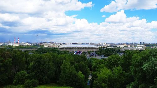 High angle view of trees and buildings against sky