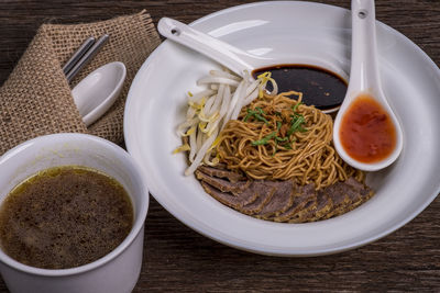 High angle view of sarawak mee kolok noodle in bowl on table