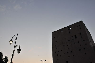 Low angle view of building against sky at dusk