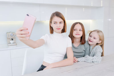 Portrait of young woman using mobile phone