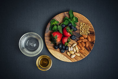 Directly above shot of fruit slices against black background