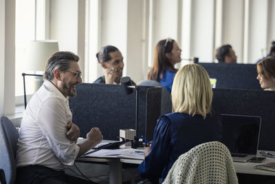 Two professionals discussing in office