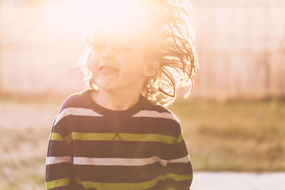 Portrait of boy standing outdoors