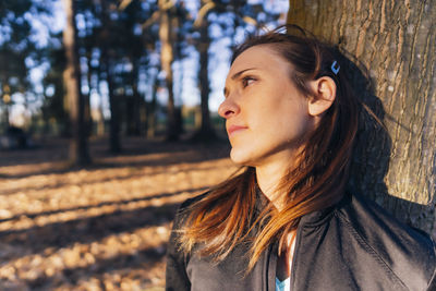 Portrait of beautiful young woman looking away