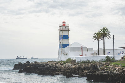 View of santa marta lighthouse on the estuary of the river tagus in cascais, portugal