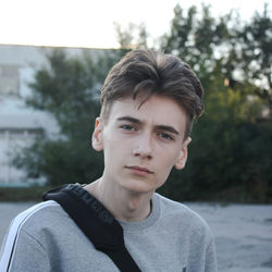 Portrait of boy standing outdoors