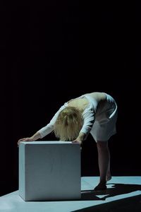 Full length of woman standing on wall