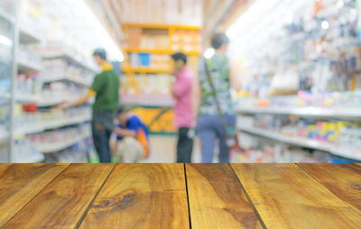 People walking on wooden floor