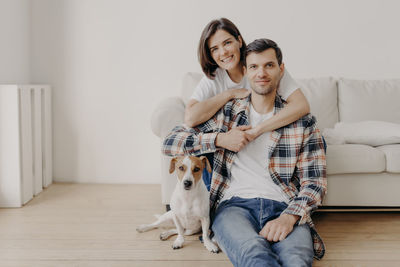 Portrait of happy couple at home